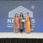Apurva being felicitated by the organisers